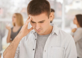 Interpreting ambiguous social cues as positive decreases symptoms of social anxiety over time